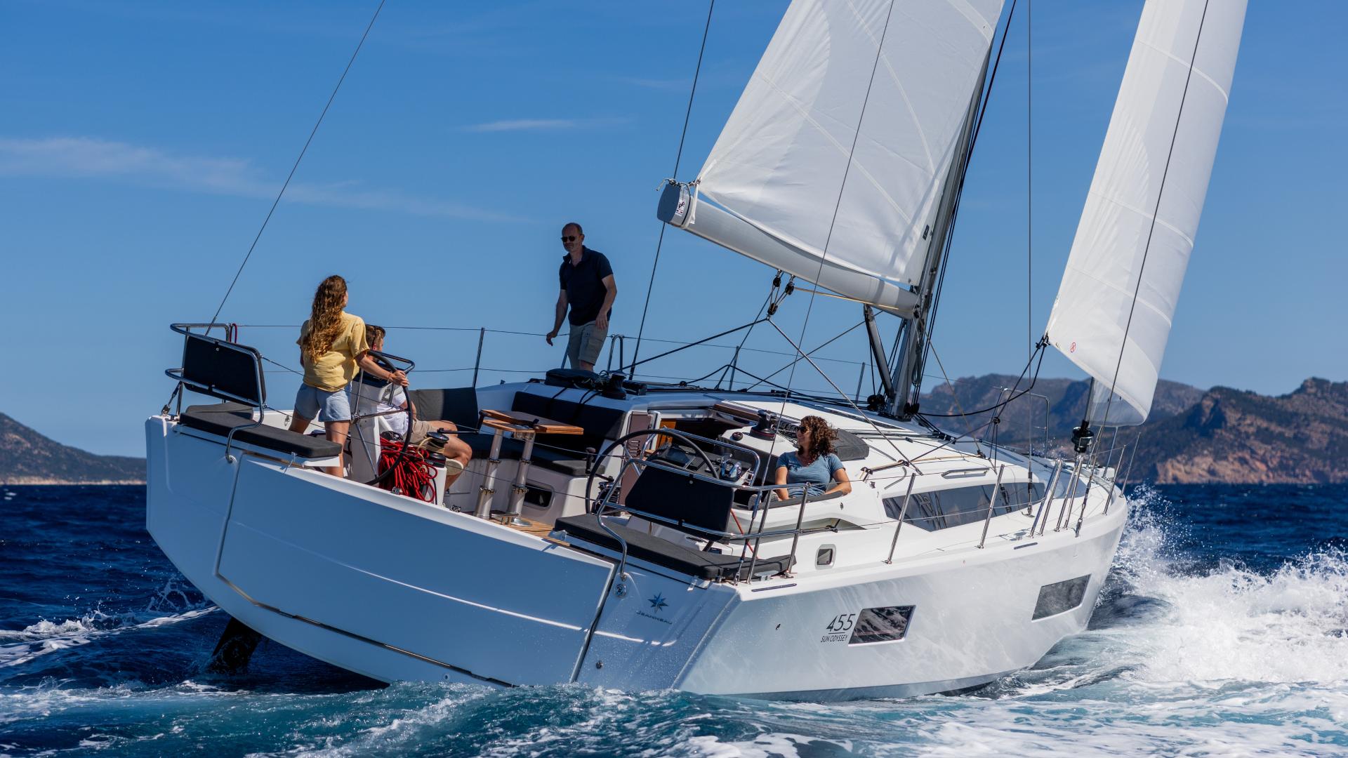 Sun Odyssey 455 sailing under way with crew in the cockpit